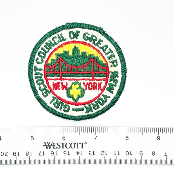 Embroidered patch with 'Girl Scout Council of Greater New York' logo on a white background