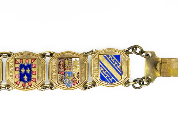 Perfect for vintage jewelry lovers: our Vintage French Souvenir Panel Bracelet provides a stunning display of French heraldic crests. Shop today!