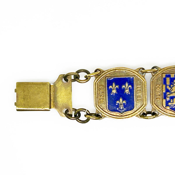 Perfect for vintage jewelry lovers: our Vintage French Souvenir Panel Bracelet provides a stunning display of French heraldic crests. Shop today!