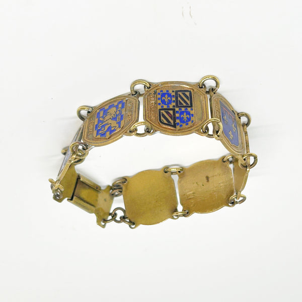 Perfect for vintage jewelry lovers: our Vintage French Souvenir Panel Bracelet provides a stunning display of French heraldic crests. Shop today!