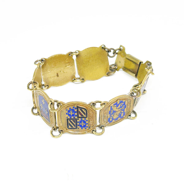 Perfect for vintage jewelry lovers: our Vintage French Souvenir Panel Bracelet provides a stunning display of French heraldic crests. Shop today!