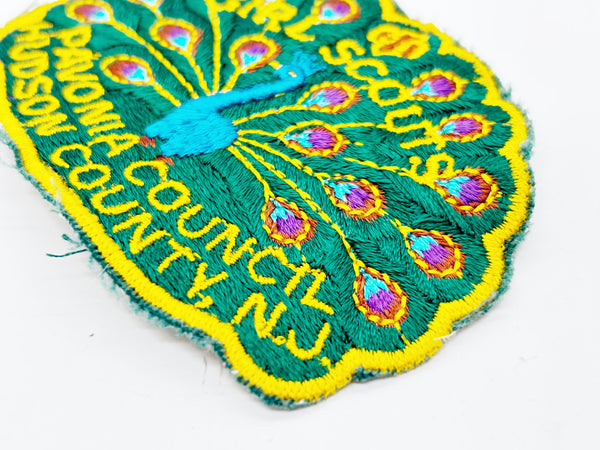 Celebrate Girl Scout heritage with this authentic vintage Pavonia Council patch from Hudson County, New Jersey. The striking peacock design served as the council's proud symbol, representing the organization's values and spirit. 