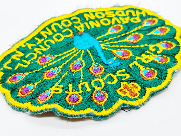 Celebrate Girl Scout heritage with this authentic vintage Pavonia Council patch from Hudson County, New Jersey. The striking peacock design served as the council's proud symbol, representing the organization's values and spirit. 