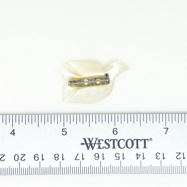 Perfect for vintage jewelry lovers: our Hand Carved Vintage Mother of Pearl Peace Dove Pin- 1960s provides a timeless symbol of peace. Shop today!