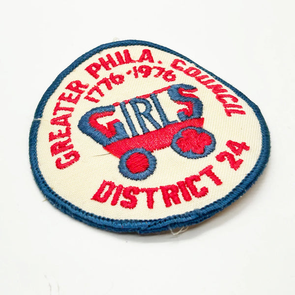 This vintage Greater Phila. Girls Council District 24 patch from the American Bicentennial period features the dates "1776-1976" embroidered in red along the top curve, commemorating the 200th anniversary of American independence. 