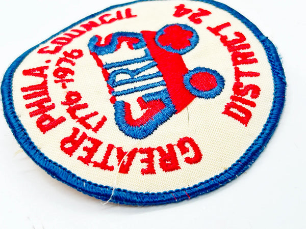 This vintage Greater Phila. Girls Council District 24 patch from the American Bicentennial period features the dates "1776-1976" embroidered in red along the top curve, commemorating the 200th anniversary of American independence. 