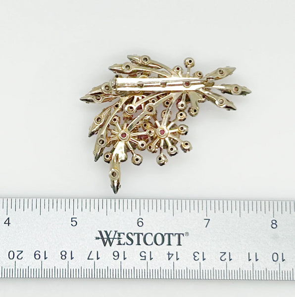 Add a touch of unique style and vibrance to any outfit with this stunning vintage pink brooch. Featuring a captivating design of four layers and various shades of pink stones, including a vibrant round faceted pink stone at the center of each section. It is surrounded by round pink iridescent and vivid stones, as well as several striped watermelon marquise cabochon stones for a unique finishing touch.