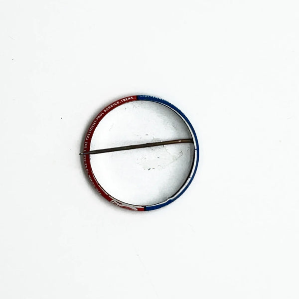 Celebrate a pivotal moment in American political history with the Nixon-Agnew Pin Back from the 1972 presidential campaign. Featuring bold red and blue colors with crisp white lettering, this vintage pin showcases the names of incumbent President Richard M. Nixon and Vice President Spiro Agnew, representing the Republican Party. 