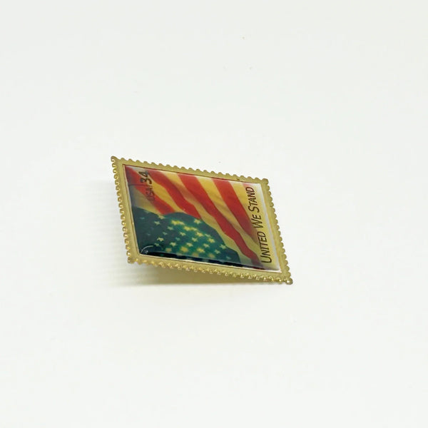  A perfect replica of the 34 cent stamp, reminiscent of a time before Forever stamps, this pin was created by the United States Post Office to showcase and honor our Flag. 