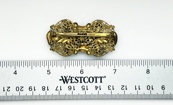 Dazzling 1930s Czech Purple Glass Filigree Brooch - Experience exquisite filigree craftsmanship with vibrant purple stones. Timeless vintage charm. Shop now!