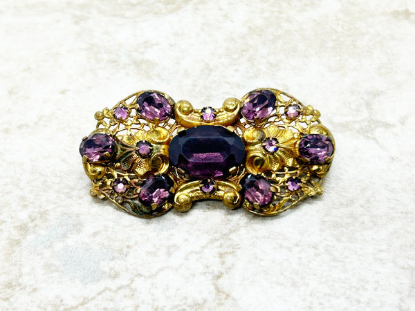 Dazzling 1930s Czech Purple Glass Filigree Brooch - Experience exquisite filigree craftsmanship with vibrant purple stones. Timeless vintage charm. Shop now!
