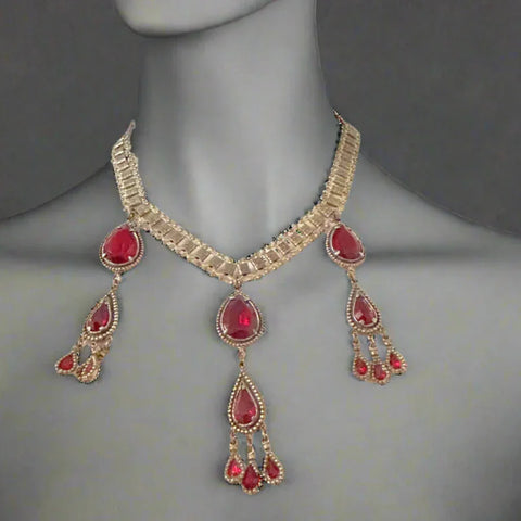 Experience breathtaking beauty with our exclusive Ornate Vintage Drop Necklace. Radiant red teardrop stones set in three long cascading drops, topped with two more tiers of red teardrops, create an eye-catching sparkle that will leave everyone awestruck. 
