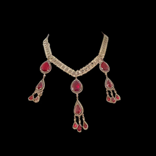 Experience breathtaking beauty with our exclusive Ornate Vintage Drop Necklace. Radiant red teardrop stones set in three long cascading drops, topped with two more tiers of red teardrops, create an eye-catching sparkle that will leave everyone awestruck. 