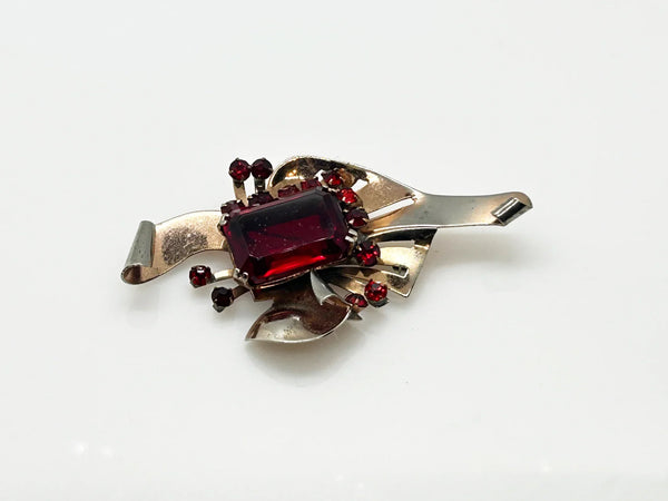 Mid Century Sterling Statement Brooch with Vivid Red Stones - Make a dramatic statement with this vintage brooch featuring a brilliant ruby red center stone. Shop now!