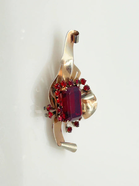 Mid Century Sterling Statement Brooch with Vivid Red Stones - Make a dramatic statement with this vintage brooch featuring a brilliant ruby red center stone. Shop now!