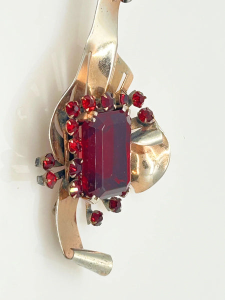 Mid Century Sterling Statement Brooch with Vivid Red Stones - Make a dramatic statement with this vintage brooch featuring a brilliant ruby red center stone. Shop now!