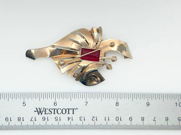 Mid Century Sterling Statement Brooch with Vivid Red Stones - Make a dramatic statement with this vintage brooch featuring a brilliant ruby red center stone. Shop now!