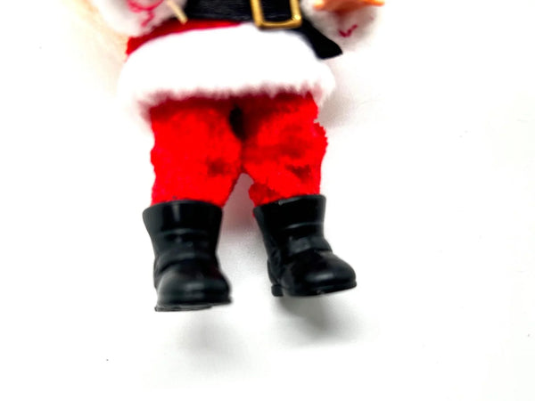 The 2003 Mattel Barbie Kelly Club Santa Claus ornament doll (Model #B1347) is a 4 to 5-inch collectible fashion doll featuring blonde hair and blue eyes.