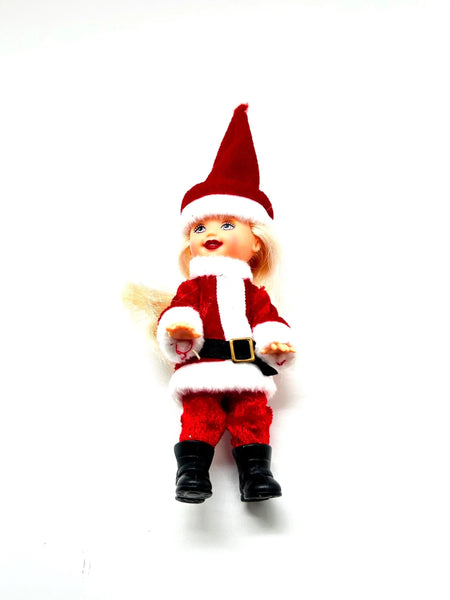 The 2003 Mattel Barbie Kelly Club Santa Claus ornament doll (Model #B1347) is a 4 to 5-inch collectible fashion doll featuring&nbsp;Barbie's younger sister, Kelly, dressed in a red and white Santa-inspired outfit, complete with a long red hat, black boots, and a black belt.