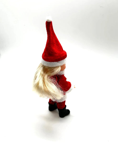 The 2003 Mattel Barbie Kelly Club Santa Claus ornament doll (Model #B1347) is a 4 to 5-inch collectible fashion doll featuring&nbsp;Barbie's younger sister, Kelly, dressed in a red and white Santa-inspired outfit, complete with a long red hat, black boots, and a black belt.