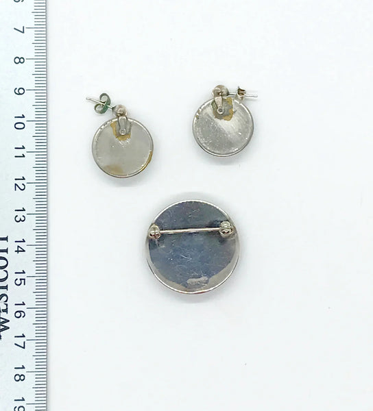 This delightful sterling silver set features an adorable black Scottie dog that's ready to prance right into your jewelry collection! The charming brooch pin (1 1/8" x 1 1/8") adds a playful pop to any dress, sweater, blouse, or scarf, while the matching pierced post earrings (approximately 1 3/4" long) complete the look with tail-wagging style.