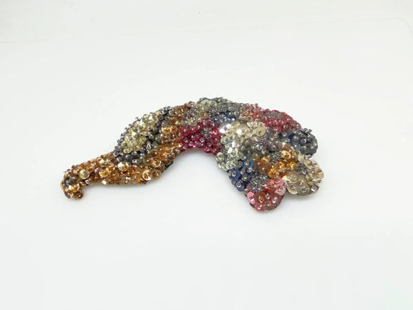 Measuring an impressive 5.25 inches long, this brooch offers a bold statement piece that can elevate any outfit—whether pinned on a jacket, scarf, or hat. Perfect for vintage lovers and those who appreciate unique accessories