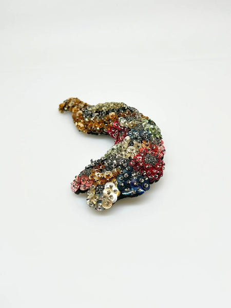 Measuring an impressive 5.25 inches long, this brooch offers a bold statement piece that can elevate any outfit—whether pinned on a jacket, scarf, or hat. Perfect for vintage lovers and those who appreciate unique accessories
