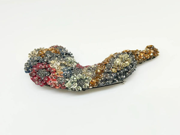 This stunning large peacock brooch showcases an exquisite array of multi-colored sequins in vibrant shades of blue, red, gold, pink, and more, capturing the eye with its lively palette. Meticulously handmade on a sturdy black felt backing, it highlights exceptional craftsmanship and attention to detail.