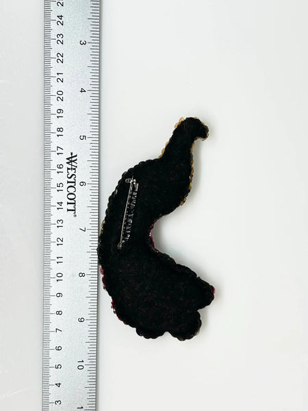 Measuring an impressive 5.25 inches long, this brooch offers a bold statement piece that can elevate any outfit—whether pinned on a jacket, scarf, or hat. Perfect for vintage lovers and those who appreciate unique accessories