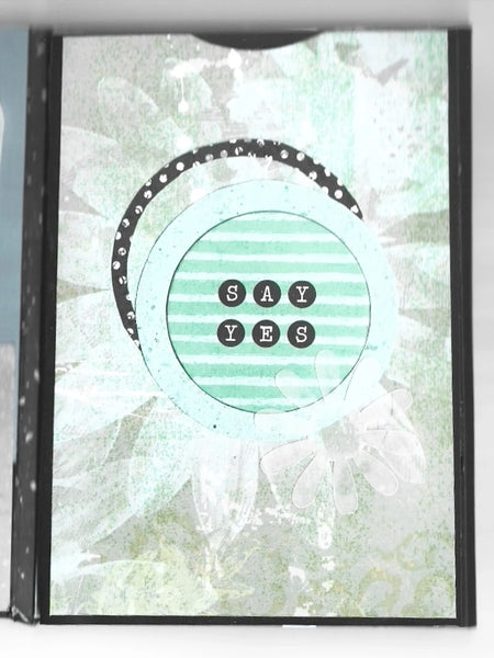 Celebrate determination and achievement with the She Believed Mini Album, a beautifully handcrafted journal that inspires and motivates. This carefully designed keepsake features intricate details, multiple slots, and inserts to hold cherished memories, including two additional mini journals tucked inside