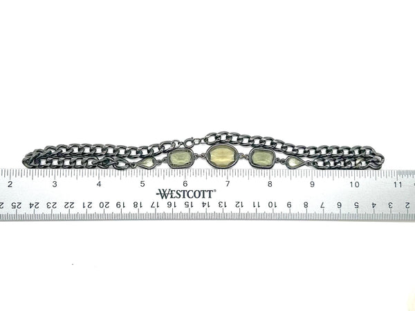 This stunning 1980s necklace features a sophisticated mix of oval, rectangular, and marquise-cut smoky glass stones, each expertly bezel-set into a blackened metal chain.