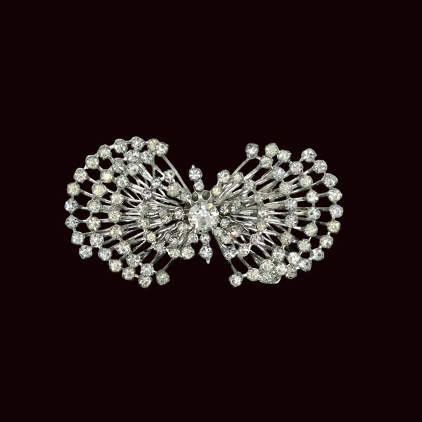 Perfect for vintage jewelry lovers: our Sparkling Vintage Atomic Silvertone Rhinestone Pin provides layered brilliance and a unique, eye-catching look. Shop today!