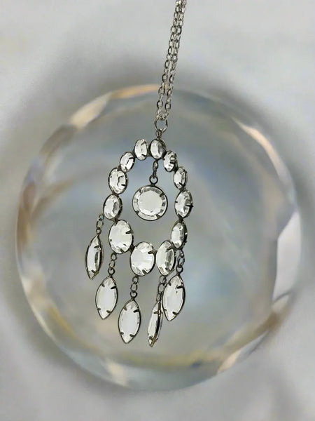 Indulge in the timeless beauty of our estate Art Deco Circle Crystal Pendant. Inspired by the opulence and glamour of the Art Deco era, this exquisite piece showcases an impressive open back design. 