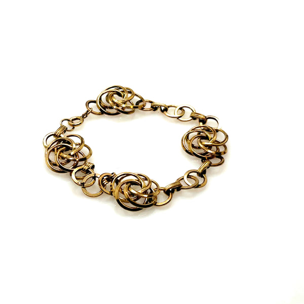 Vintage Gold Tone Multi-Ring Swirl Love Knot Bracelet & Screw Back Earrings Demi Parure Set