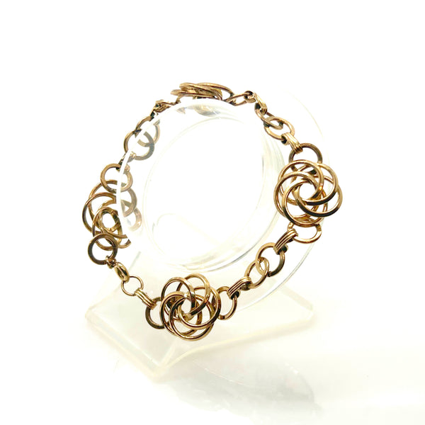 Vintage Gold Tone Multi-Ring Swirl Love Knot Bracelet & Screw Back Earrings Demi Parure Set