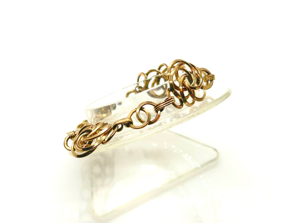 Vintage Gold Tone Multi-Ring Swirl Love Knot Bracelet & Screw Back Earrings Demi Parure Set
