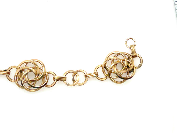 Vintage Gold Tone Multi-Ring Swirl Love Knot Bracelet & Screw Back Earrings Demi Parure Set