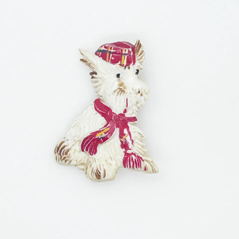 Adorable mid-century white Scottish Terrier brooch sporting a festive red plaid cap and scarf! This charming 1.75" x 1.5" plastic pup features cute brown accents on feet, ears, and face. 