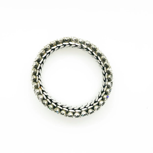 Sparkle up your vintage jewelry collection with this stunning three-row rhinestone bracelet expansion bracelet. Crafted in the classic style beloved from the 1940s through 1960s, this piece showcases brilliant clear glass rhinestones secured in a flexible silver-tone metal band. 