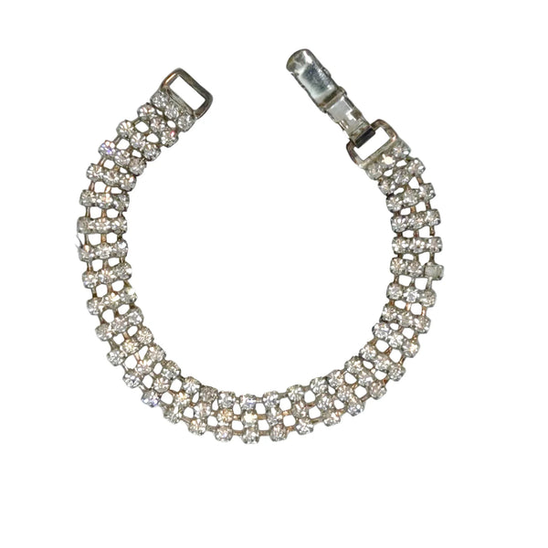 Perfect for vintage bracelet lovers: our Stunning Vintage Three Row Rhinestone Bracelet provides refined sophistication with bright stones and secure fit. Shop today!