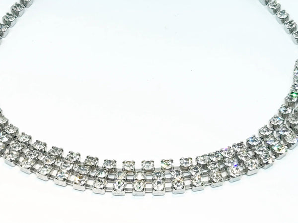 Classic Vintage Three Row Rhinestone Choker: Perfect for an evening out or formal event. Features three rows of radiant prong-set stones. Shop now!