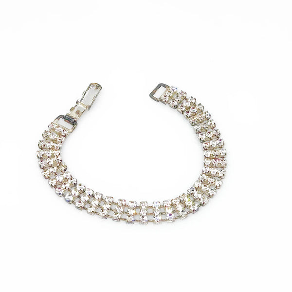 Perfect for vintage bracelet lovers: our Stunning Vintage Three Row Rhinestone Bracelet provides refined sophistication with bright stones and secure fit. Shop today!