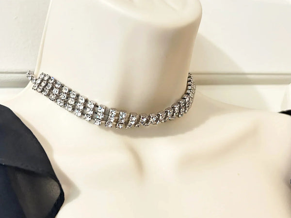 Make your everyday or evening look extra glamorous with this dazzling classic vintage rhinestone choker. The approximately 15" long choker boasts a convenient hook clasp, allowing for a customized and comfortable fit.
