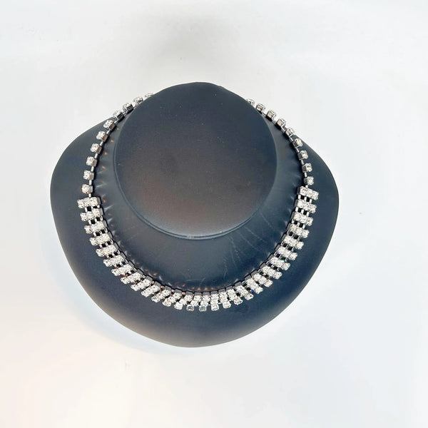 Classic Vintage Three Row Rhinestone Choker: Perfect for an evening out or formal event. Features three rows of radiant prong-set stones. Shop now!