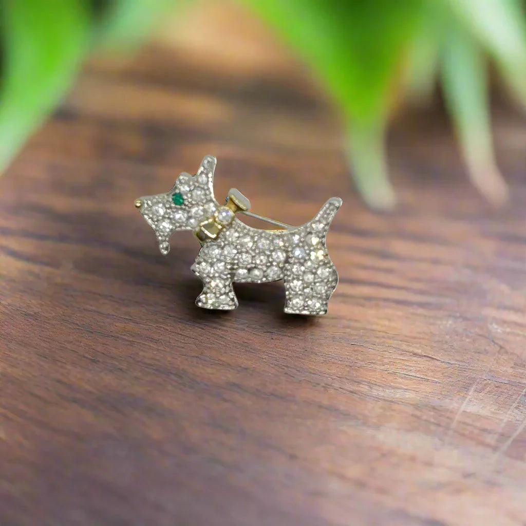 This brooch may be small in size, but is big on sparkle.&nbsp; Add a dash of canine charm to your outfit with this adorable vintage terrier brooch! This pint-sized pup brings major bling factor with its dazzling coat of pave set white rhinestones that catch the light with every movement.