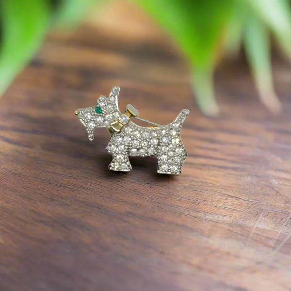 This brooch may be small in size, but is big on sparkle.&nbsp; Add a dash of canine charm to your outfit with this adorable vintage terrier brooch! This pint-sized pup brings major bling factor with its dazzling coat of pave set white rhinestones that catch the light with every movement.
