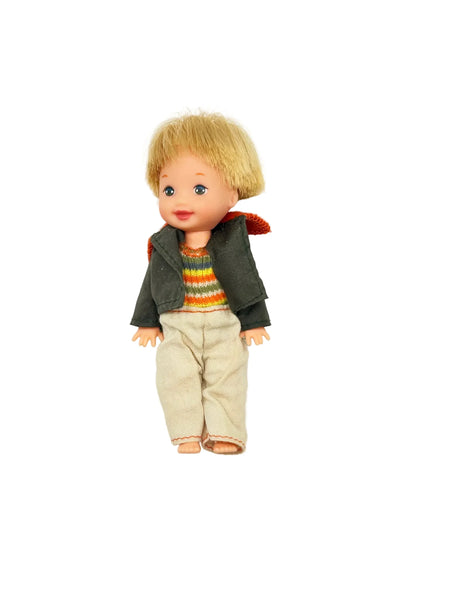 Vintage boy doll with blonde hair, striped sweater, and corduroy pants, collector doll