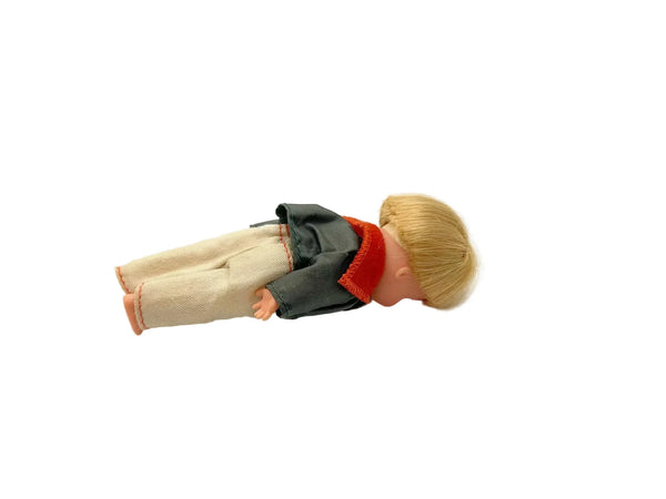 Vintage blonde doll with green jacket, red collar, and cream pants, collector doll