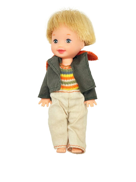 Vintage boy doll with blonde hair, rainbow sweater, and corduroy pants, collector doll