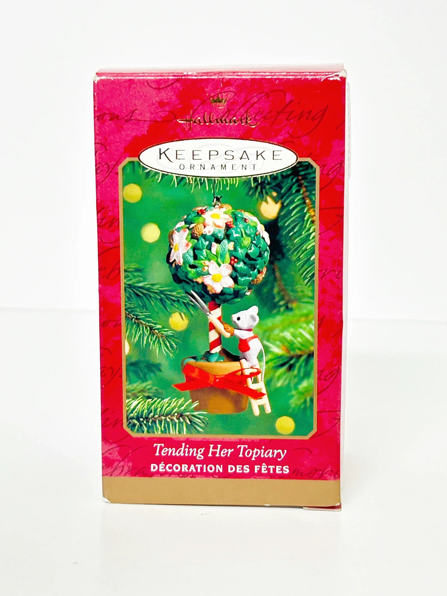 Perfect for ornament collectors: our Hallmark Keepsake Ornament "Tending Her Topiary" (2000) provides charming, detailed holiday decor. Shop today!